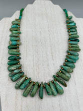 Load image into Gallery viewer, This striking Extra Large Turquoise Stone Beaded Necklace With Brass Finish Metal Beads instantly adds a touch of luxury to any outfit. Beautifully crafted with an alluring blend of extra large turquoise stone beads and brass finish metal beads, this distinctive necklace invokes an elegant cascade of vibrant color.    Measurements:    Necklace is 21 1/2 &quot; in length adjustable to 23&quot;
