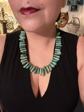 Load image into Gallery viewer, This striking Extra Large Turquoise Stone Beaded Necklace With Brass Finish Metal Beads instantly adds a touch of luxury to any outfit. Beautifully crafted with an alluring blend of extra large turquoise stone beads and brass finish metal beads, this distinctive necklace invokes an elegant cascade of vibrant color.    Measurements:    Necklace is 21 1/2 &quot; in length adjustable to 23&quot;
