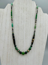 Load image into Gallery viewer, This exquisite necklace features natural ruby zoisite, black obsidian, turquoise magnesite, bone, glass and metal beads, offering a variety of sizes, shapes, textures, and colors.    Measurements:  Necklace - 20&quot; in length
