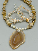 Load image into Gallery viewer, Delicate white moon stone chip and glass beaded hoop earrings featuring chic gold accents and tiny conch shells. Perfect for nature lovers, these boho-inspired summer earrings will add a subtle sophistication to any outfit.  Measurements: 2&quot; length
