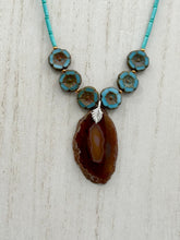 Load image into Gallery viewer, This exquisite Natural Dark Brown Agate Geode Sliced Stone Chip Necklace adds a unique touch of luxury to any look. Its banded geode and hibiscus flower glass beads offer a sophisticated bohemian style, and the natural gemstones are sure to make a statement. Add it to any outfit for a stylish and timeless touch. Measurements:     Necklace is 18” in length - pendant is 1 3/4” Height    Amber Stone Chip Earrings: 2&quot; in length  

