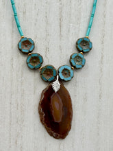 Load image into Gallery viewer, This exquisite Natural Dark Brown Agate Geode Sliced Stone Chip Necklace adds a unique touch of luxury to any look. Its banded geode and hibiscus flower glass beads offer a sophisticated bohemian style, and the natural gemstones are sure to make a statement. Add it to any outfit for a stylish and timeless touch. Measurements:     Necklace is 18” in length - pendant is 1 3/4” Height    Amber Stone Chip Earrings: 2&quot; in length  
