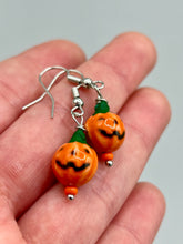 Load image into Gallery viewer, These super tiny and cute Peruvian Ceramic Jack-o-Lantern pumpkin halloween bead earrings are just perfect for fall and halloween. If halloween is not a season, rather a lifestyle, then these are perfect for every day outfits!  Measurements: 7/8” in length, pumpkin beads 11mm
