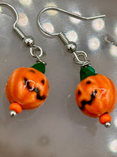 Load image into Gallery viewer, These super tiny and cute Peruvian Ceramic Jack-o-Lantern pumpkin halloween bead earrings are just perfect for fall and halloween. If halloween is not a season, rather a lifestyle, then these are perfect for every day outfits!  Measurements: 7/8” in length, pumpkin beads 11mm
