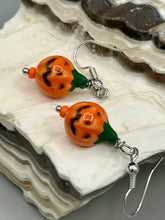 Load image into Gallery viewer, These super tiny and cute Peruvian Ceramic Jack-o-Lantern pumpkin halloween bead earrings are just perfect for fall and halloween. If halloween is not a season, rather a lifestyle, then these are perfect for every day outfits!  Measurements: 7/8” in length, pumpkin beads 11mm
