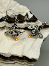 Load image into Gallery viewer, Honey bee shaped metal fish hook earrings with black and yellow glass beads. Measurement: 1&quot; in length
