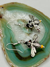 Load image into Gallery viewer, Honey bee shaped metal fish hook earrings with black and yellow glass beads. Measurement: 1&quot; in length
