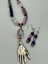 Load image into Gallery viewer, These stunning light and dark purple glass beaded earrings are the perfect accessory for summer ensembles and bohemian-inspired styles, offering a subtle yet stylish touch.  Measurements: 1 1/2” in length
