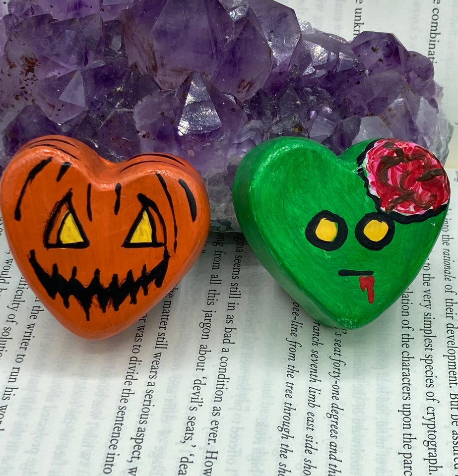 Hand sculpted polymer clay heart shaped magnets of Jack -O-Lantern design and zombie.