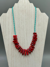 Load image into Gallery viewer, Experience the striking beauty of Southwest Style with this necklace adorned with vibrant blue turquoise and bold red coral beads. Complete the look with matching earrings, perfect for any occasion. Skillfully crafted using metal wire and secured with a hook-eye clasp for a secure and stylish finish.

Measurements: 21" in length
