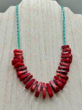 Load image into Gallery viewer, Experience the striking beauty of Southwest Style with this necklace adorned with vibrant blue turquoise and bold red coral beads. Complete the look with matching earrings, perfect for any occasion. Skillfully crafted using metal wire and secured with a hook-eye clasp for a secure and stylish finish.

Measurements: 21" in length
