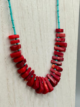 Load image into Gallery viewer, Experience the striking beauty of Southwest Style with this necklace adorned with vibrant blue turquoise and bold red coral beads. Complete the look with matching earrings, perfect for any occasion. Skillfully crafted using metal wire and secured with a hook-eye clasp for a secure and stylish finish.

Measurements: 21" in length

