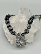 Load image into Gallery viewer, This rustic necklace features an eye-catching large trapezoid-shaped Picasso jasper, hematite, square-shaped snowflake obsidian combo set in a unique and chic design. Handcrafted from genuine stones, this necklace is perfect for any bohemian look.   Measurements:  Necklace is 21&quot;

