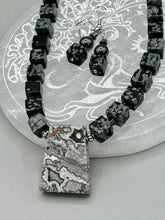 Load image into Gallery viewer, This rustic necklace features an eye-catching large trapezoid-shaped Picasso jasper, hematite, square-shaped snowflake obsidian combo set in a unique and chic design. Handcrafted from genuine stones, this necklace is perfect for any bohemian look.   Measurements:  Necklace is 21&quot;
