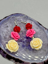 Load image into Gallery viewer, Crafted from quartzite, these highly detailed rose beads come in three striking shades of red, soft pink, and white beaded earrings. This is the ideal accessory for those interested in Dia De Los Muertos as well as those with an appreciation for gardens. Whether dressing up or down, these earrings will lend a distinctive touch to your fashion.  Measurements: 1 1/2” in length 
