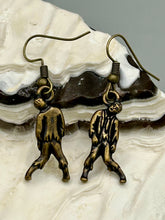 Load image into Gallery viewer, The Halloween-inspired Zombie Charm Antique Brass Earrings are crafted from Tierracast lead-free pewter and are the perfect complement to any look. Boasting fun spooky charms, these living dead earrings are a great way to celebrate the spooky season all year round.  Measurements: 1 ” in length
