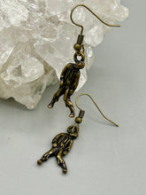 Load image into Gallery viewer, The Halloween-inspired Zombie Charm Antique Brass Earrings are crafted from Tierracast lead-free pewter and are the perfect complement to any look. Boasting fun spooky charms, these living dead earrings are a great way to celebrate the spooky season all year round.  Measurements: 1 ” in length
