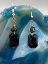 Load image into Gallery viewer, Elegantly crafted from black rectangular and circular glass beads, these dainty earrings offer a versatile style that can effortlessly elevate any ensemble.  Measurements: 1 3/8” in length
