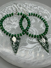 Load image into Gallery viewer, Green-White Qinghai Green Jasper Stone Beaded Hoop Earrings provide a nature-inspired look that is perfect for any boho-chic style. These earrings feature natural green jasper stone triangle pendant with small beads of silver and dark apple green magnesite stone for subtle accent. Show off your bohemian look with these eye-catching hoops.  Measurements: 3&quot; length 
