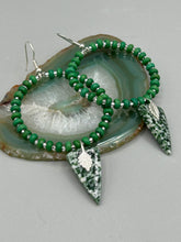 Load image into Gallery viewer, Green-White Qinghai Green Jasper Stone Beaded Hoop Earrings provide a nature-inspired look that is perfect for any boho-chic style. These earrings feature natural green jasper stone triangle pendant with small beads of silver and dark apple green magnesite stone for subtle accent. Show off your bohemian look with these eye-catching hoops.  Measurements: 3&quot; length 

