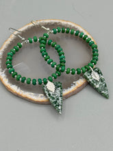 Load image into Gallery viewer, Green-White Qinghai Green Jasper Stone Beaded Hoop Earrings provide a nature-inspired look that is perfect for any boho-chic style. These earrings feature natural green jasper stone triangle pendant with small beads of silver and dark apple green magnesite stone for subtle accent. Show off your bohemian look with these eye-catching hoops.  Measurements: 3&quot; length 
