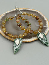 Load image into Gallery viewer, Green-White Qinghai Green Jasper Stone Beaded Hoop Earrings provide a nature-inspired look that is perfect for any boho-chic style. These earrings feature natural green jasper stone triangle pendant with champagne mix melon Czech faceted round glass beads.  Glass beads have a tint of light champagne, amber, dark green and gold shimmer for subtle accent. Show off your bohemian look with these eye-catching hoops. Antique Copper Plated Surgical Steel Hammered Long Ear-wire French Hook Earrings. 
