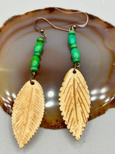 Load image into Gallery viewer, Single-stranded earring features bone carved leaf charm earrings with bright green magnesite stone beads. Antique Copper Plated Surgical Steel Hammered Long Ear-wire French Hook Earrings.  Measurements: 3” in length   
