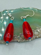 Load image into Gallery viewer, This eye-catching piece set of earrings consists of large fire engine red and tiny teal glass beads for a vibrant and bold look.  Measurements: 1 1/2” in length 
