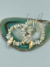 Load image into Gallery viewer, Delicate white moon stone chip and glass beaded hoop earrings featuring chic gold accents and tiny conch shells. Perfect for nature lovers, these boho-inspired summer earrings will add a subtle sophistication to any outfit.  Measurements: 2&quot; length
