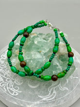 Load image into Gallery viewer, Nature inspired double-strand tigers eye and bright green magnesite stone beaded bracelet. Crafted with metal wire and fastened with a lobster claw clasp.  Measurements:  Bracelet: 7 3/4&quot; in length    

