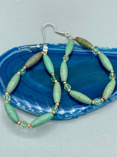 Load image into Gallery viewer, Crafted with exquisite detail, these Forest Green Magnesite Stone and Light Green and Gold Glass Beaded Fish Hook Earrings are perfect for any Hippie Vibe, Shabby Chic, Boho Chic, Nature Inspired, or Bohemian look.  Measurements: 2 1/2&quot; length 
