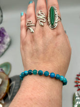 Load image into Gallery viewer, Nature inspired single-strand sea blue stripped agate round stone beaded with silver glass beaded bracelet. Crafted with metal wire and fastened with a lobster claw clasp.  Measurements:  Bracelet: 8&quot; in length   
