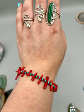 Load image into Gallery viewer, This distinctive Southwestern Style bracelet boasts a captivating combination of large red coral and blue-green turquoise glass beads for a visual impact. Crafted with metal wire and fastened with a lobster claw clasp, this bracelet is sure to command attention.  Measurements:  Bracelet: 8&quot; in length 
