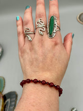 Load image into Gallery viewer, Single-strand dark red round glass beaded bracelet with dark red faceted crystals. Crafted with metal wire and fastened with a lobster claw clasp.  Measurements:   Bracelet: 8&quot; in length   
