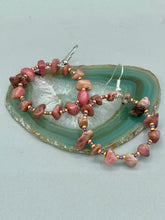 Load image into Gallery viewer, These Rhodonite Stone Chip Beaded Hoop Earrings feature natural rhodonite stones and light purple and gold glass beads for a shabby chic, boho chic, and nature-inspired bohemian look.  Measurements: 1&quot; length
