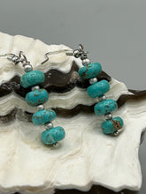 Load image into Gallery viewer, These earrings feature a single strand constructed with quartzite turquoise stone  and silver glass beaded earrings.  A pair of unique, nature-inspired look.  Measurements: 1 1/4" length
