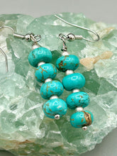Load image into Gallery viewer, These earrings feature a single strand constructed with quartzite turquoise stone  and silver glass beaded earrings.  A pair of unique, nature-inspired look.  Measurements: 1 1/4" length
