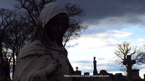 Photography of an cemetery angel statue in mourning.