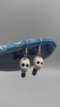 Load and play video in Gallery viewer, Peruvian Ceramic Skull Bead With Spine Earrings, Pastel Goth, Dia De Los Muertos Calavera, Day of the Dead Jewelry, La Catrina
