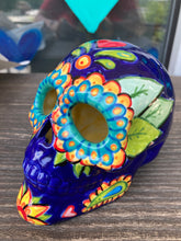 Load image into Gallery viewer, I wanted to create a skully that represented the eternal love for a special kitty cat in your life. Dark royal blue ceramic sugar skull with black cat silhouette is sitting admiring the sun going down. This Day Of The Dead ceramic skull art was created for the cat lovers who adore their sweet kitty. Measurements: H 4” x W 4” x D 5 1/2”
