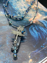 Load image into Gallery viewer, This stunning rectangular-shaped Black Labradorite Stone necklace features a wire-wrapped dragonfly pendant, completed with intricate glass bead detailing. Perfect for a summer night, it will make a bold statement.  Measurements: Necklace is 16” adjustable up to 18&quot;
