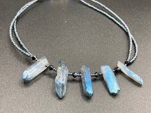 Load image into Gallery viewer, This sophisticated double-strand necklace glitters with silver and gray-tone glass beads, complemented by luminous blue crystal stone nuggets. It gracefully drapes around the neck. Measurements:  Necklace is 15 1/4”adjustable up to 17&quot; in length
