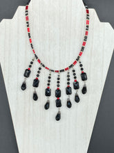 Load image into Gallery viewer, This Vampire Goth style choker necklace features a mix of black and red glass beads with a hanging large tear drop black bead that gives it a depth and complexity of color. Perfect for formal dresses as it gracefully drapes down the neck. Necklace is 15” adjustable to 18"

