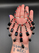 Load image into Gallery viewer, This Vampire Goth style choker necklace features a mix of black and red glass beads with a hanging large tear drop black bead that gives it a depth and complexity of color. Perfect for formal dresses as it gracefully drapes down the neck. Necklace is 15” adjustable to 18"
