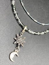 Load image into Gallery viewer, This Dainty Smiling Crescent Moon And Star Silver And Gray Choker Style Necklace features a variety of shimmering glass beads in light silver and gray tones. Varying in shape and size, these beads lend a unique and witchy celestial vibe to the necklace.  Measurements:  Necklace is 15 3/4”adjustable up to 18&quot;
