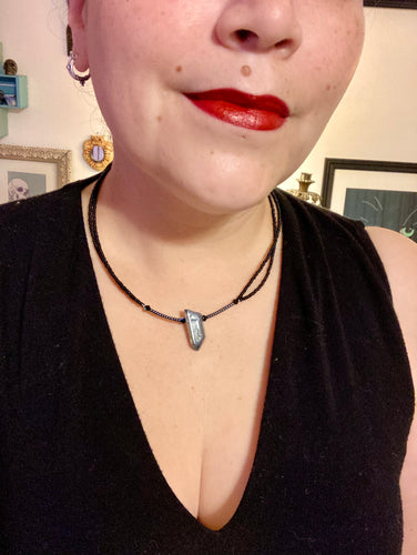 This stunningly elegant double strand necklace features a luster blue crystal stone nugget, creating a sophisticated, yet dainty look that beautifully drapes across the neck.  Necklace is 18”