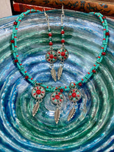 Load image into Gallery viewer, These Southwester Style Silver Feather Light Dainty Beaded Earrings are richly adorned with turquoise, bright red and dark green, and feature silver plated feather charms for a fun, dynamic effect. A perfect match for any Chingona Carbrona, La India Princess, Fierce Goddess Warrior, or Tribal Pattern look.  Measurements: 3” in length

