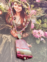 Load image into Gallery viewer, This large agate pendant features a variety of pink hues, from light to dark, and is accompanied by two strands of glass beaded necklaces with pink, silver, gold, and clear beads. The combination of colors creates a stunning and vibrant look, perfect for accessorizing any summer look.  Measurements:  Necklace is 15” adjustable up to 18&quot; in length 
