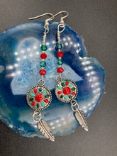 Load image into Gallery viewer, These Southwester Style Silver Feather Light Dainty Beaded Earrings are richly adorned with turquoise, bright red and dark green, and feature silver plated feather charms for a fun, dynamic effect. A perfect match for any Chingona Carbrona, La India Princess, Fierce Goddess Warrior, or Tribal Pattern look.  Measurements: 3” in length
