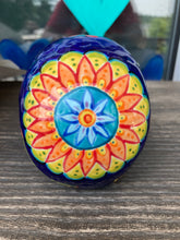 Load image into Gallery viewer, I wanted to create a skully that represented the eternal love for a special kitty cat in your life. Dark royal blue ceramic sugar skull with black cat silhouette is sitting admiring the sun going down. This Day Of The Dead ceramic skull art was created for the cat lovers who adore their sweet kitty. Measurements: H 4” x W 4” x D 5 1/2”
